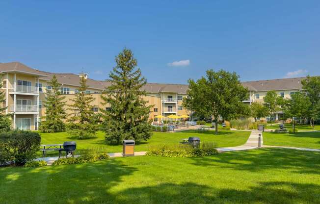 a large open space with green grass and beautiful landscaping