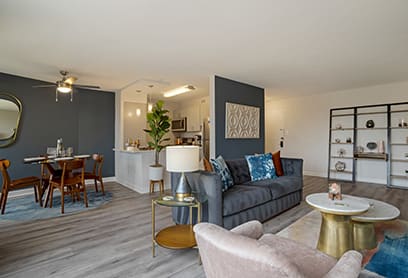 a living room and dining room with a couch and a table