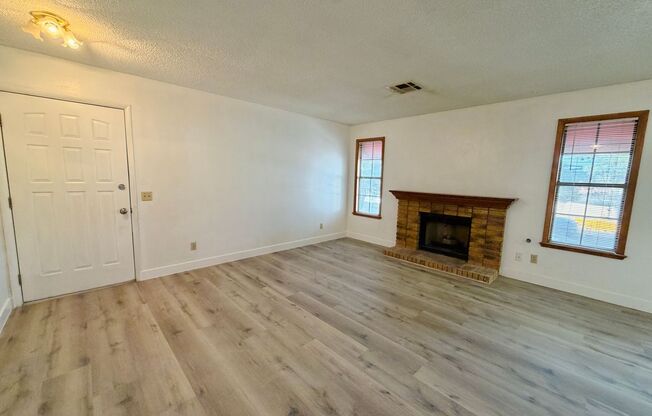 Centrally located beautiful second story condo in quiet community with vinyl plank flooring and beautiful custom showers!