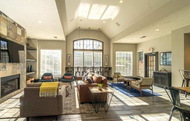 a living room with couches and chairs and a fireplace at Radbourne Lake Apartments, Charlotte, NC ? 