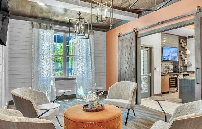 Living room with a large window and a dining area at Sterling Creek at Richmond Hill, Richmond Hill, GA, 31324
