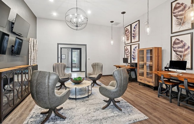 A living room with a grey chair and a coffee table.