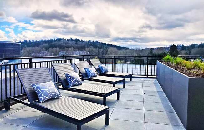 Dog-Friendly Apartments in Bothell - Community Rooftop with Lounge Chairs and an Amazing View