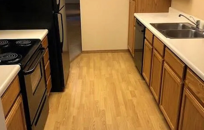 Beautiful & Spacious 2 Bed / 2 Bath Condo Near MSU – Top-Floor with Garage!