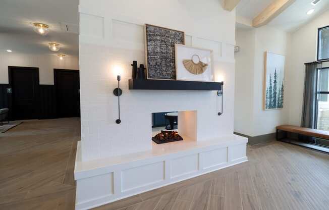 a living room with a fireplace and hardwood floors at The Crest at Acworth, Acworth, GA, 30102