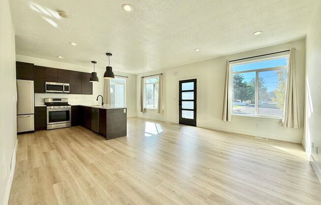 4-Bedroom Midvale Townhome | Garage + Pets Allowed + Great Location