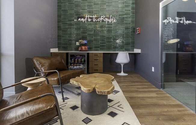 A modern living room with a glass backed sofa and a wooden coffee table.