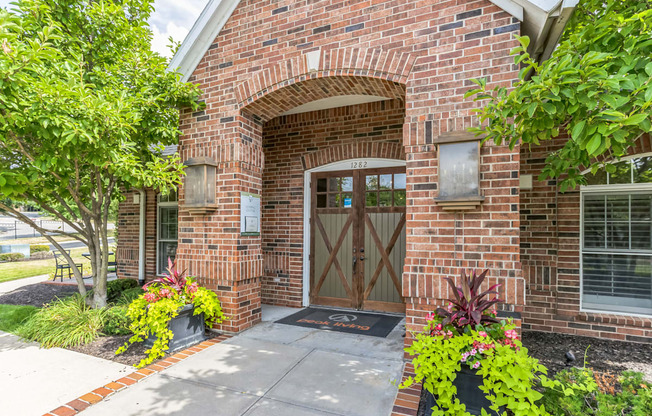 the entrance to a brick building with a wooden door