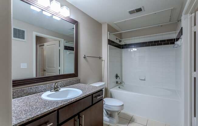 the preserve at ballantyne commons apartment bathroom with sink toilet and tub