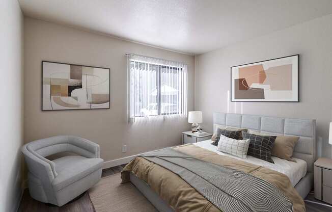 A bedroom with a bed, chair, and two framed artworks on the wall.