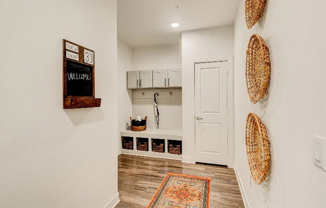Entryway with built-in storage by the entrance to a luxury apartment in Grapevine TX.