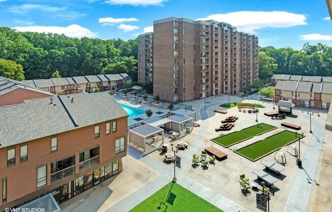 New plaza with fire pit, games, hammocks, grills and MORE! at Trillium Apartments, Virginia