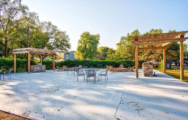 a patio with tables and chairs and a pavilion