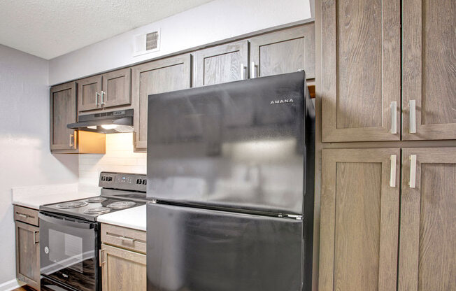 Upgraded Kitchen, black whirlpool appliances, laminate countertops