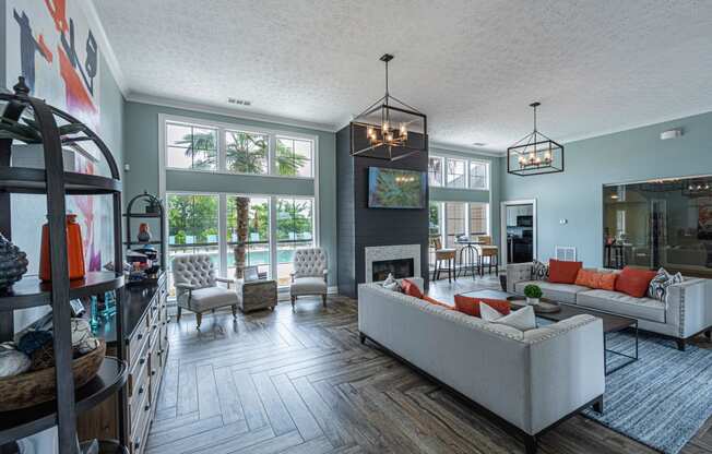 a living room with couches and chairs and a fireplace