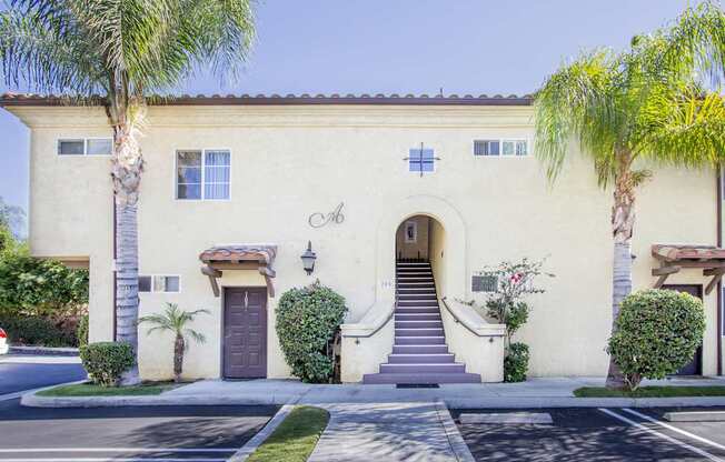 A house with a brown door and a small porch.