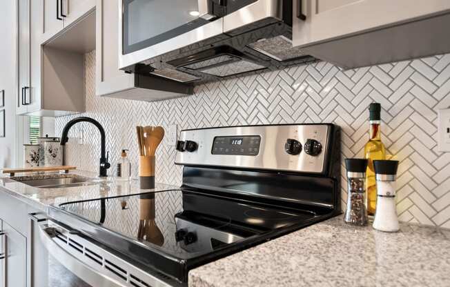 a kitchen with a stove and a sink