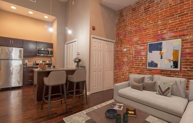 Furnished apartment with exposed brick walls