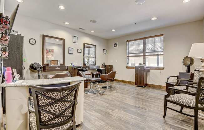 a living room with a bar with chairs and a counter top