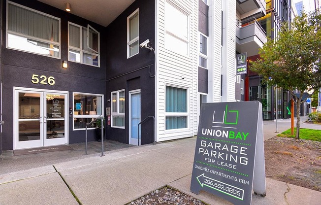 a sign in front of a building that says union bay garage parking