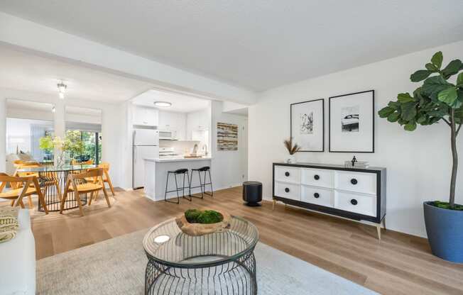 an open living room with a dining room and a kitchen