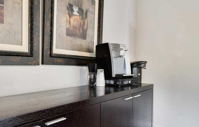 a coffee maker sitting on top of a cabinet in a hotel room at Eagles Landing Apartments, Everett, 98204