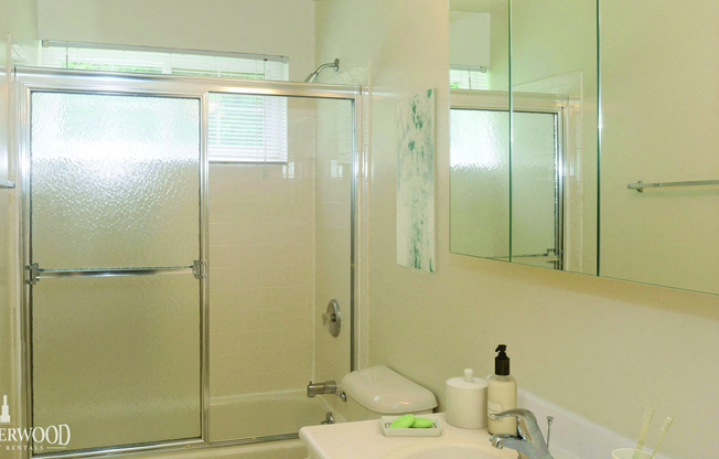 bathroom with glass shower doors at Southwood Luxury Apartments, North Amityville, 11701