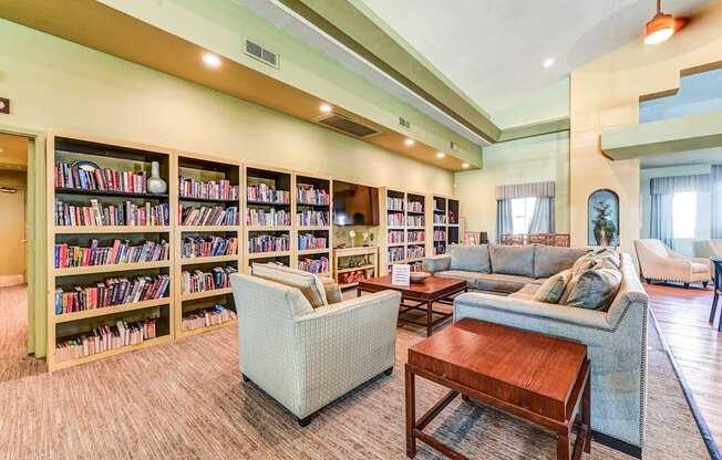 Community library sitting area at Country Club at The Meadows Senior Apartments in Las Vegas, NV, For Rent. Now leasing 1 and 2 bedroom apartments.