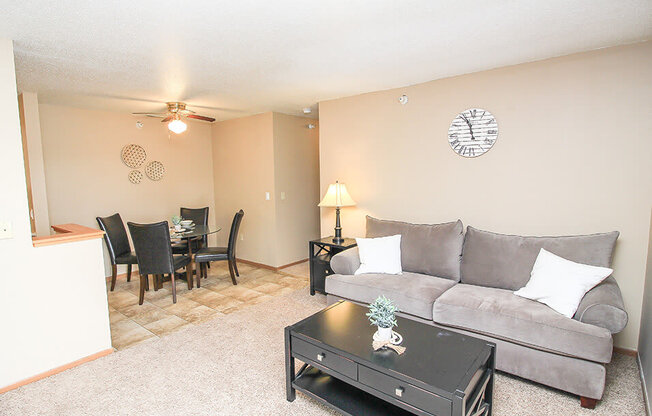 a living room with a couch and a table