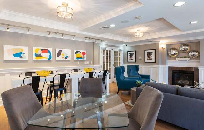 Angled View of Dining Room, Family Style Dining Table or Work From Home Space and Resident Lounge Seating at Canton Woods apartments in MA