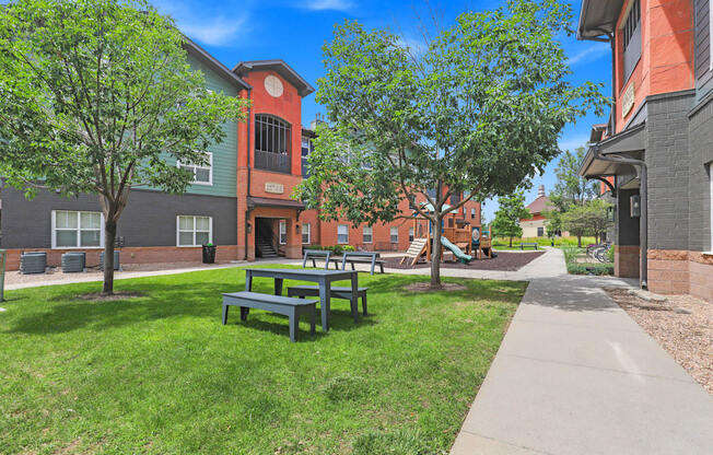 our apartments have a spacious courtyard with picnic tables at Apartments at Switchback on Platte Apartments, Littleton