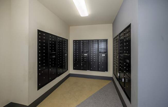 Mail and package room with black wall lockers.