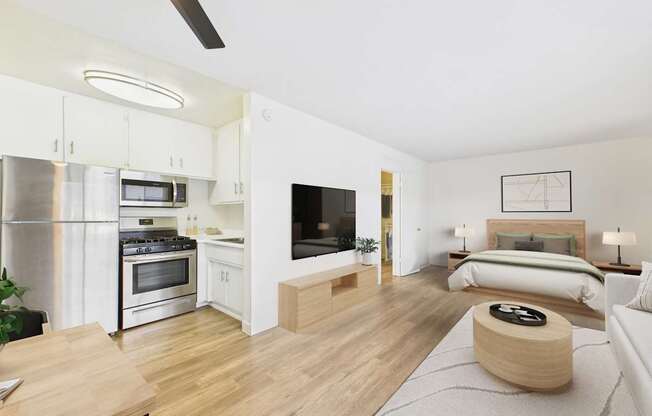 A modern kitchen with a stainless steel refrigerator, oven, and microwave.