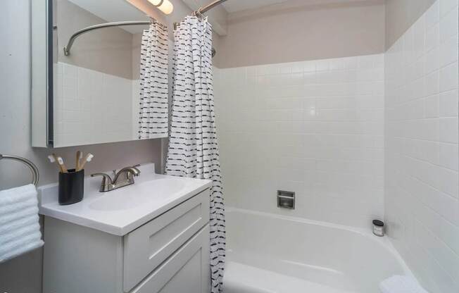 bright white model bathroom at Archer Tower in Denver, CO