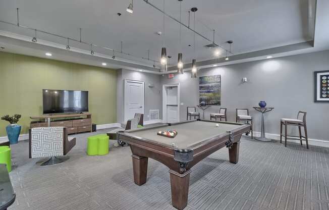 a clubhouse with a pool table and a tv at Nexus at Sandhill, Columbia, 29229