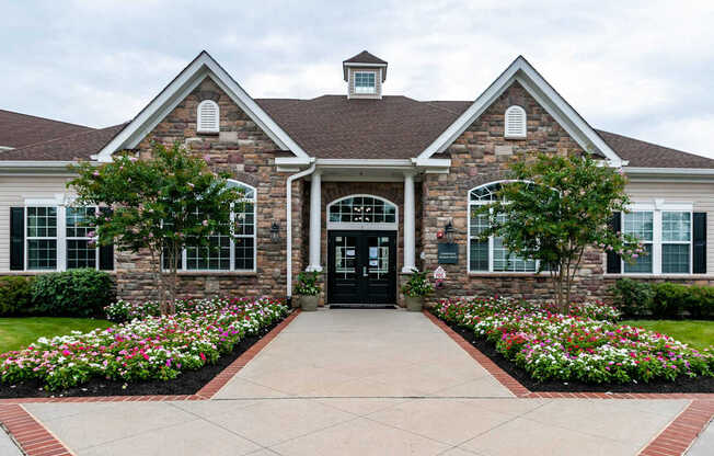 A house with a black front door and a brick facade.