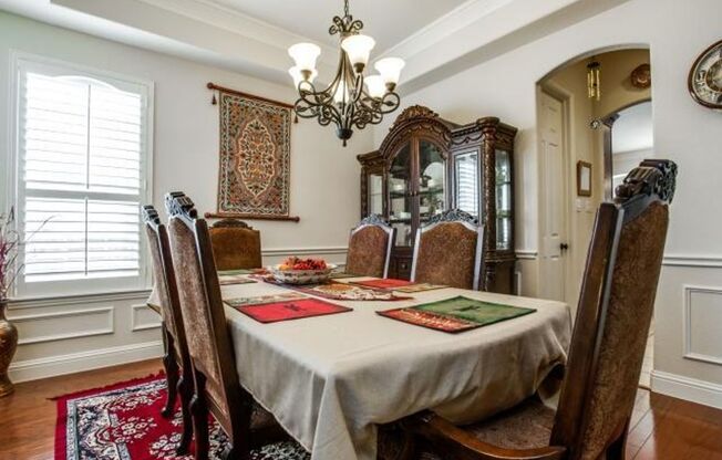 Bright and airy living room, fireplace, study, custom lighting in the formal living and dining.