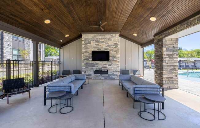 Outdoor Lounge With TV at Evolve at Parkway Apartment Homes, Concord