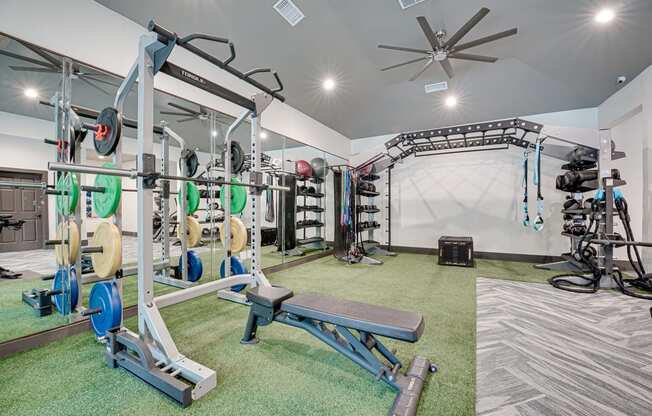 a home gym with weights and other exercise equipment