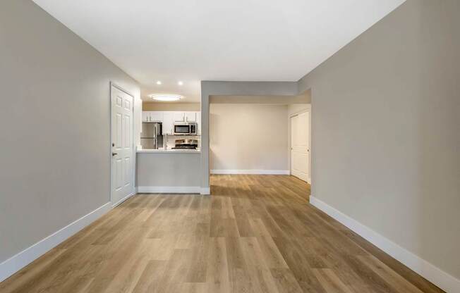 The open floorplan seamlessly connects the kitchen to the living and dining areas, making it perfect for entertaining guests or enjoying family meals.