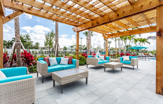 patio furniture under pergola in daytime