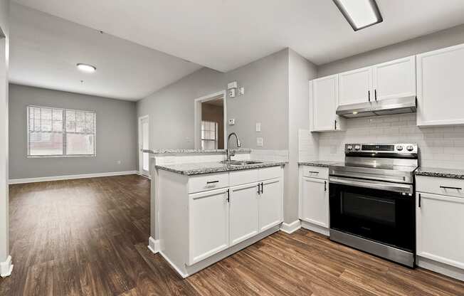 Upgraded kitchen with stainless steel appliances at Crogman School Lofts, Atlanta GA 30315