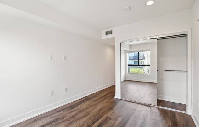 Bedroom with Closet and Vinyl  Flooring