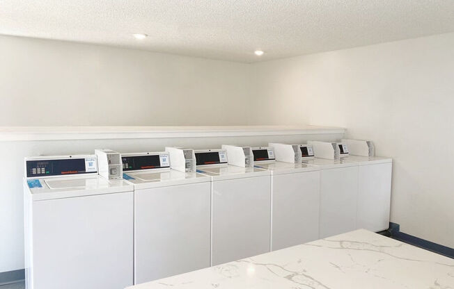 a bunch of microwaves are on display in a room at Latitude Apartments at Mission Valley, California, 92120