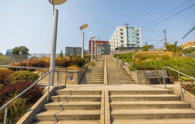 a set of stairs in a city with a building in the background