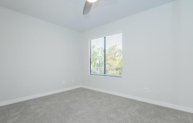 a bedroom with a large window