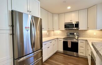 Upgraded 2 Bedroom 2 Bath Condo with Lots of Storage and Two Garage Parking Spaces
