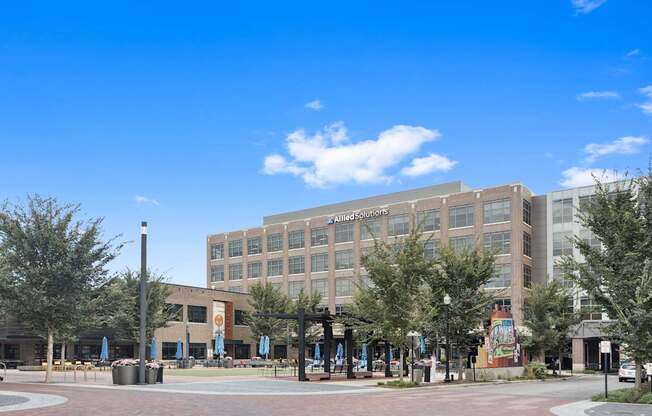 a large building with trees in front of it