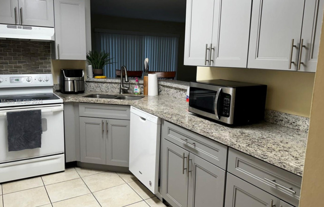 2-bedroom, 2-bathroom condo in a well-maintained gated community, featuring a spectacular direct lake view