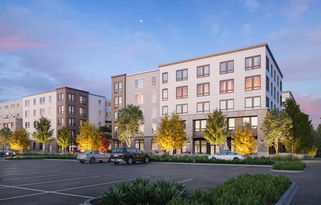 Evening light highlights the inviting design of Modera Bridle Trails, creating a warm and welcoming community atmosphere.